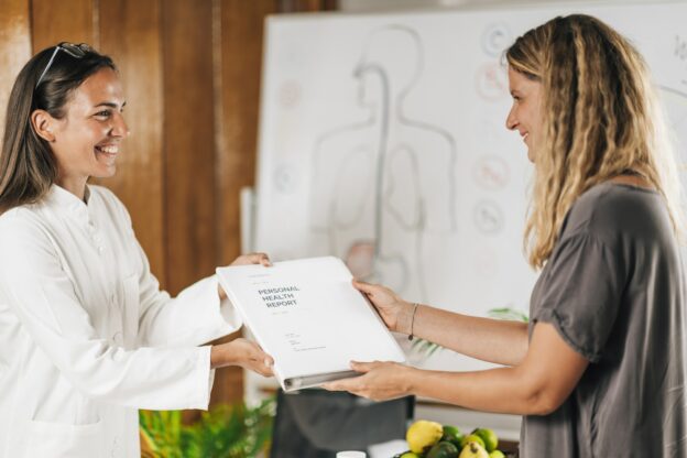 Functional Medicine Practitioner Giving Personal Health Report to the Patient